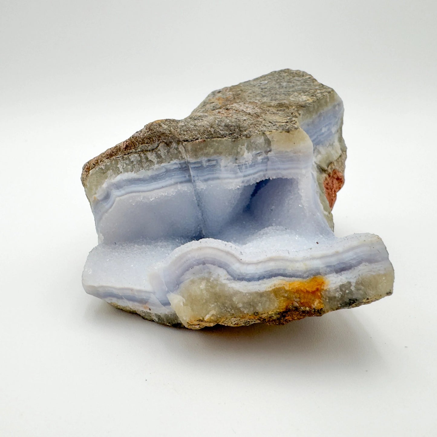 Macro view of Blue Lace Agate raw geode, showing natural sheen.