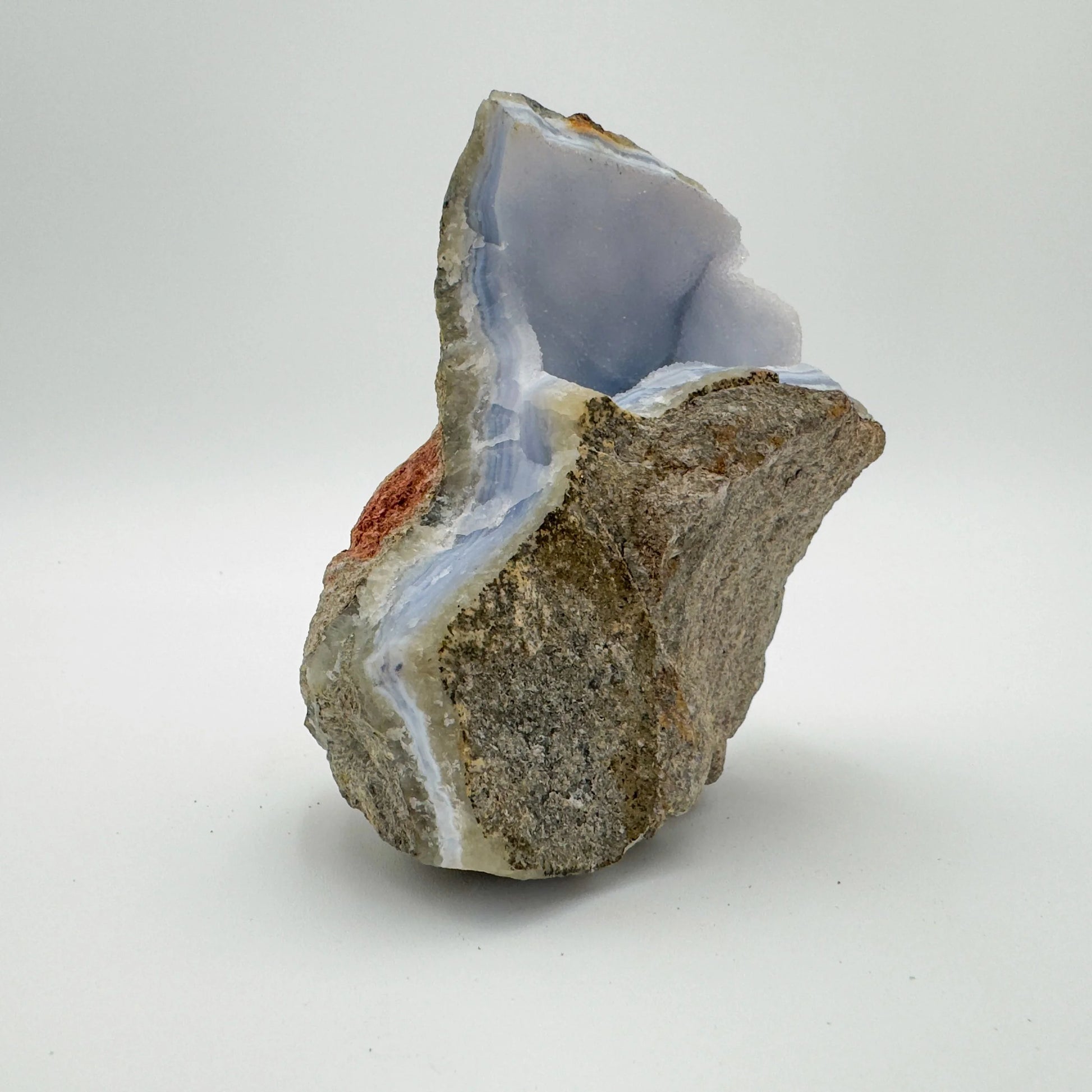 Alternate angle of Blue Lace Agate raw geode, showing characteristic patterning, traditionally used for Stress Relief.