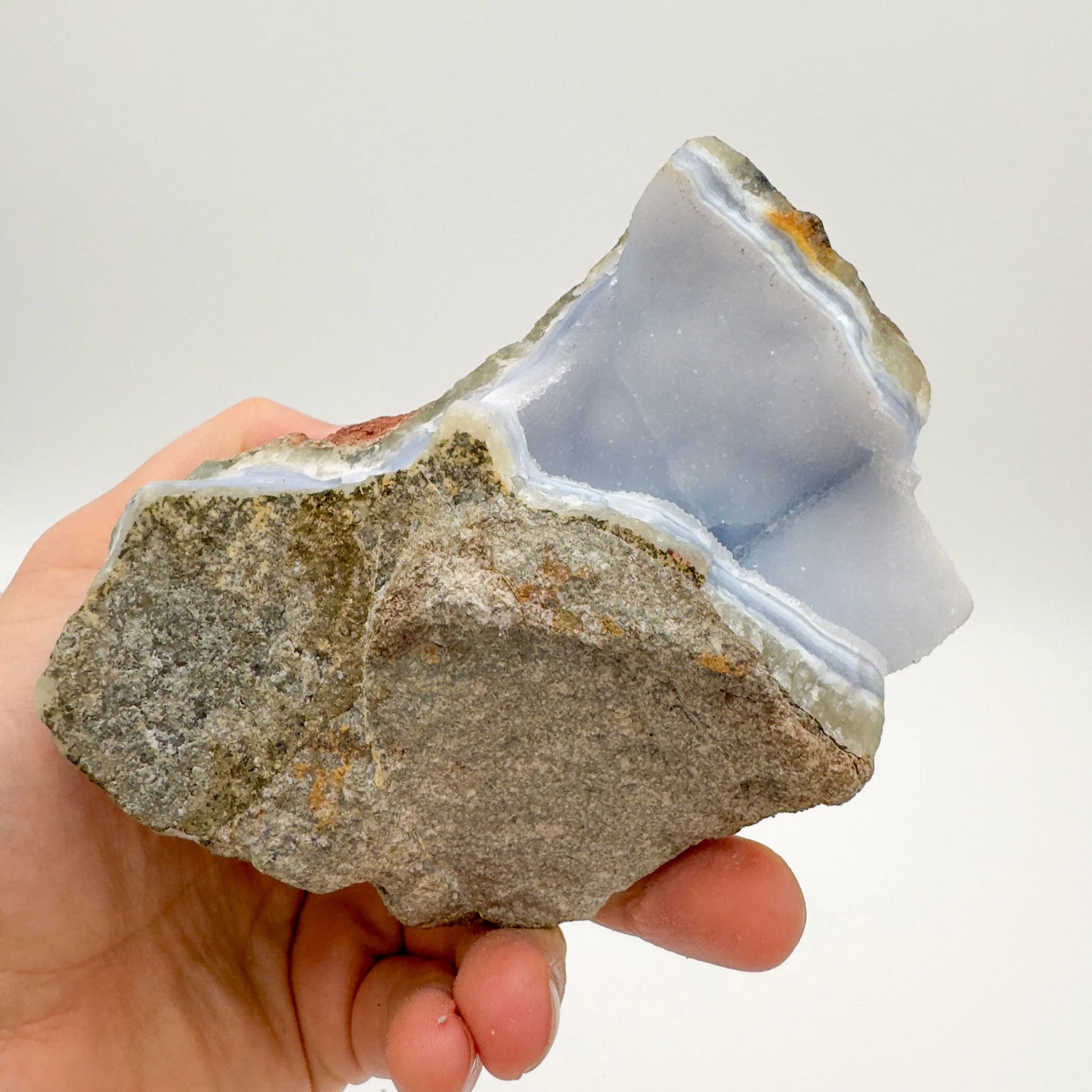 Back view of Grade AA Blue Lace Agate geode showing natural surface