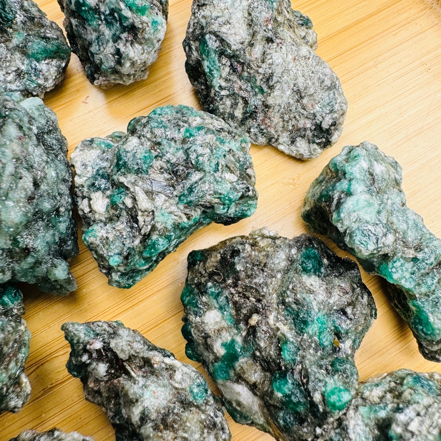 Overhead angle of Emerald raw stone, showing natural form.