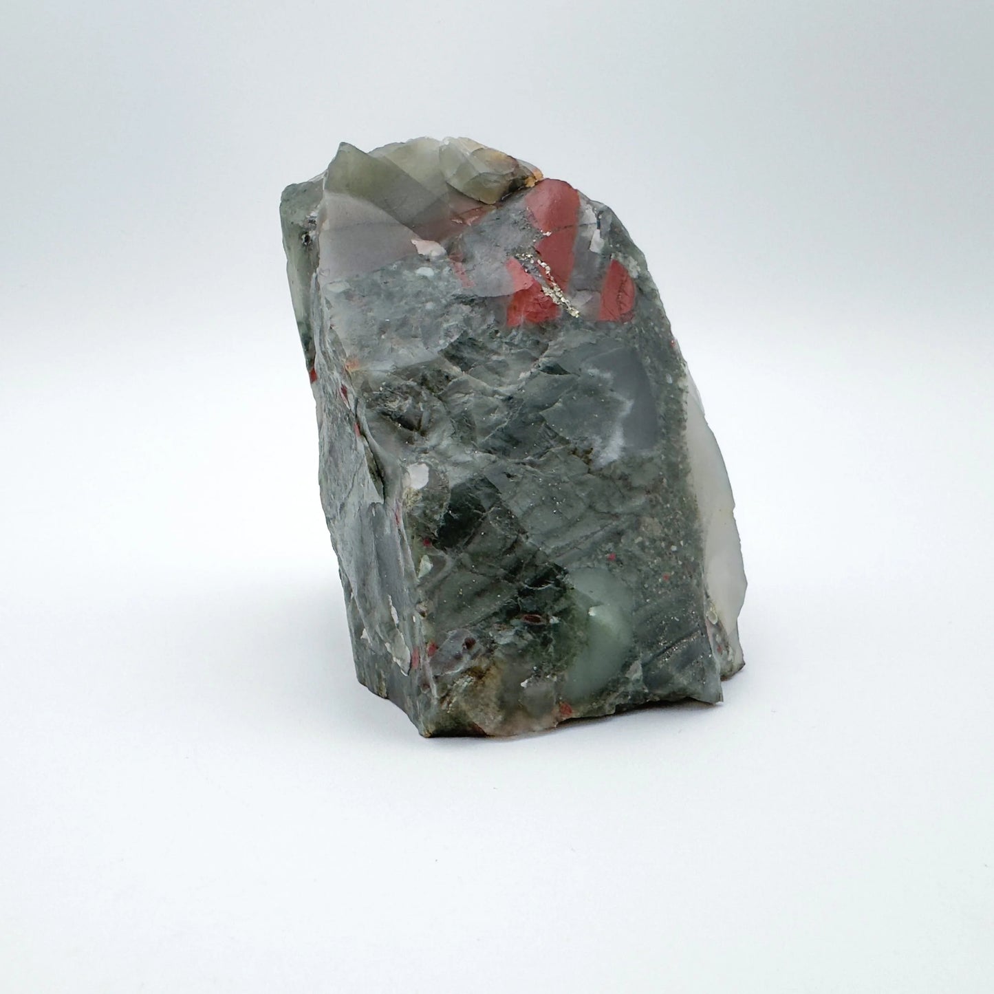 Field-of-view of Bloodstone specimen, often kept for Confidence, with weight visible in the palm.