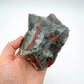Scale comparison of Bloodstone specimen, with depth visible across the surface.