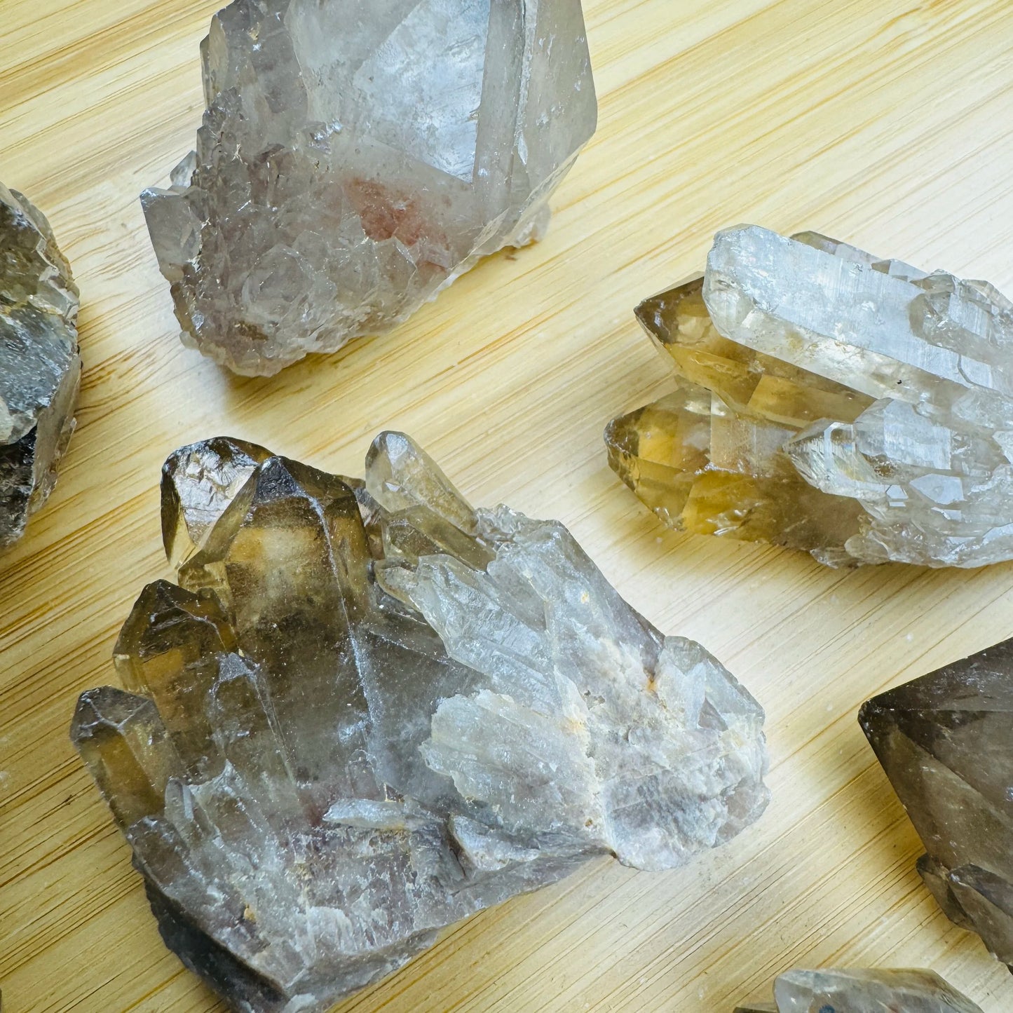 Hand-scale view of Natural Citrine stone, from Haut-Lomami, Democratic Republic of the Congo, shown in a calm studio setting.