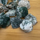 Rear view of Tree Agate raw stone, from Botswana, showing characteristic patterning.