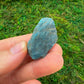 Natural light view of a Apatite raw stone associated with Focus.