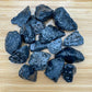 Color detail of Snowflake Obsidian raw stone, showing natural color depth, for Grounding and Emotional Healing.