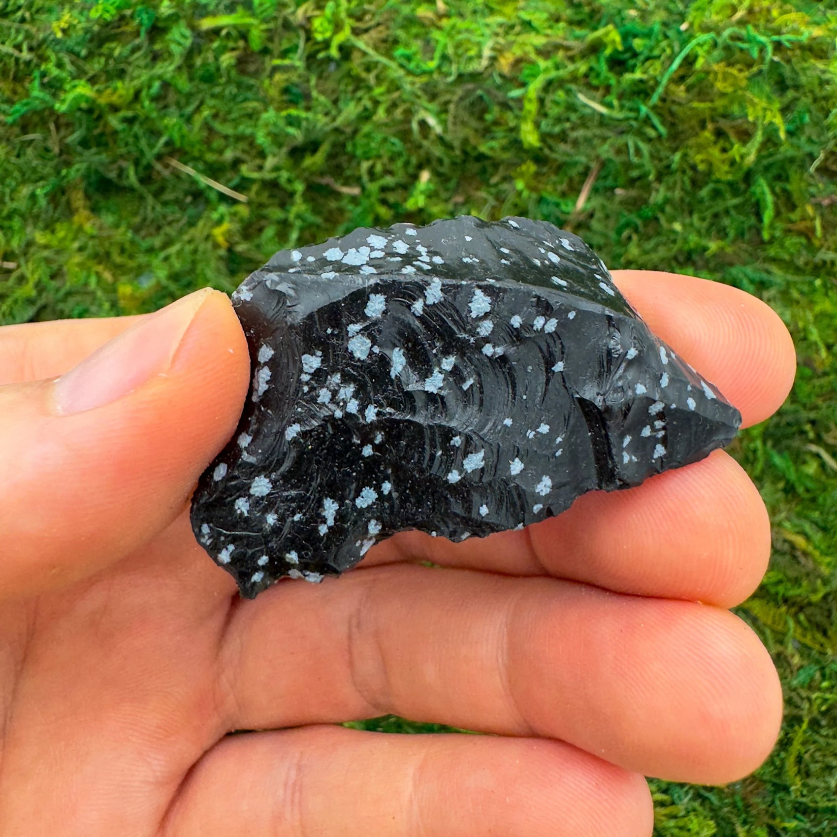 Close-up of Snowflake Obsidian raw stone, soothing wellness stone for Emotional Healing