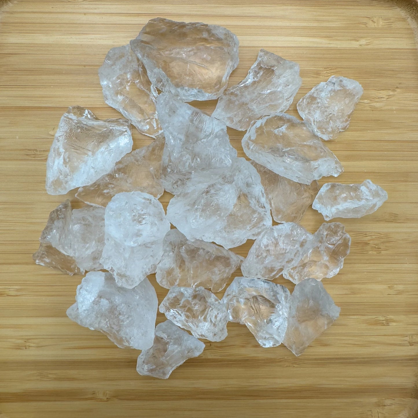Grade aa clear quartz raw held in hand for size reference