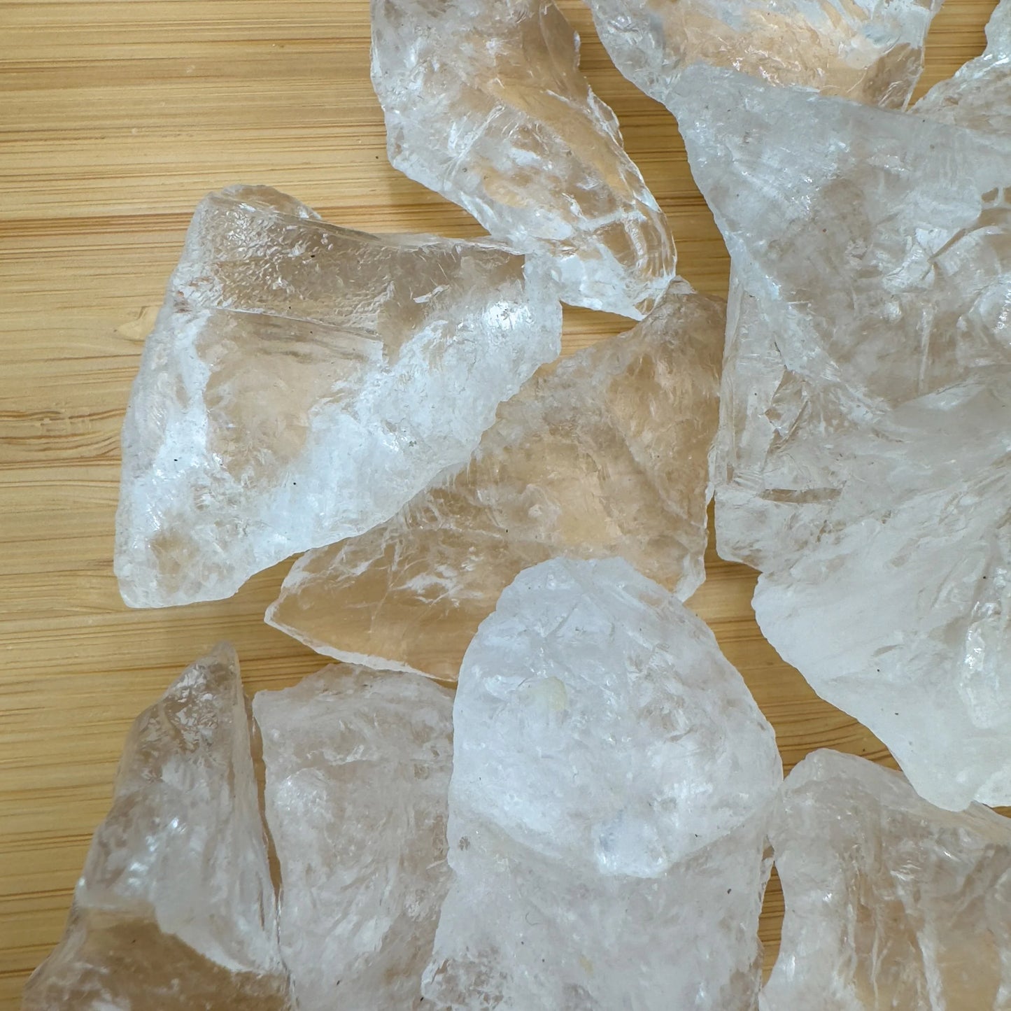 Back view of Grade AA Clear Quartz raw showing natural surface