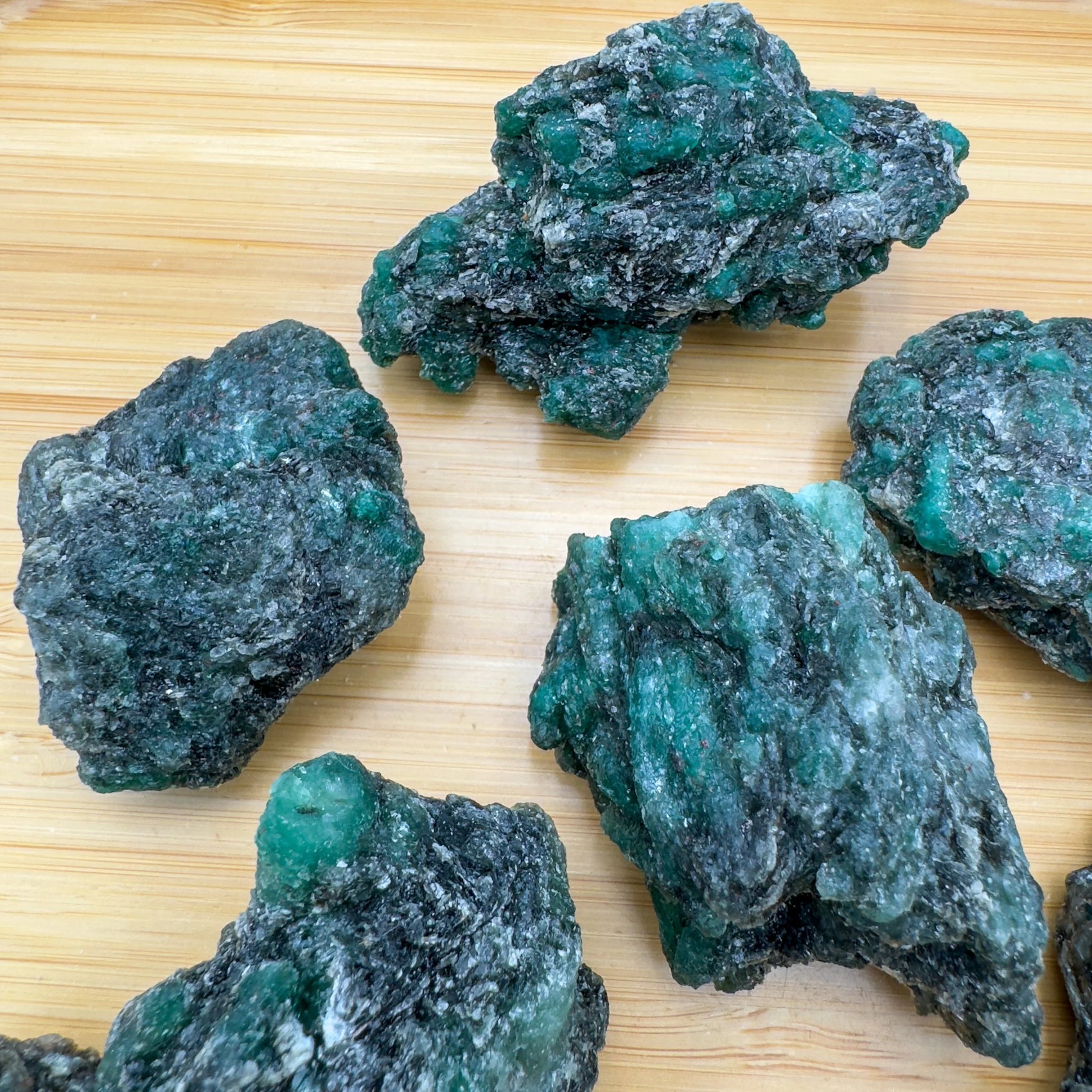 Alternate side of green Emerald raw stone, showing subtle veining.