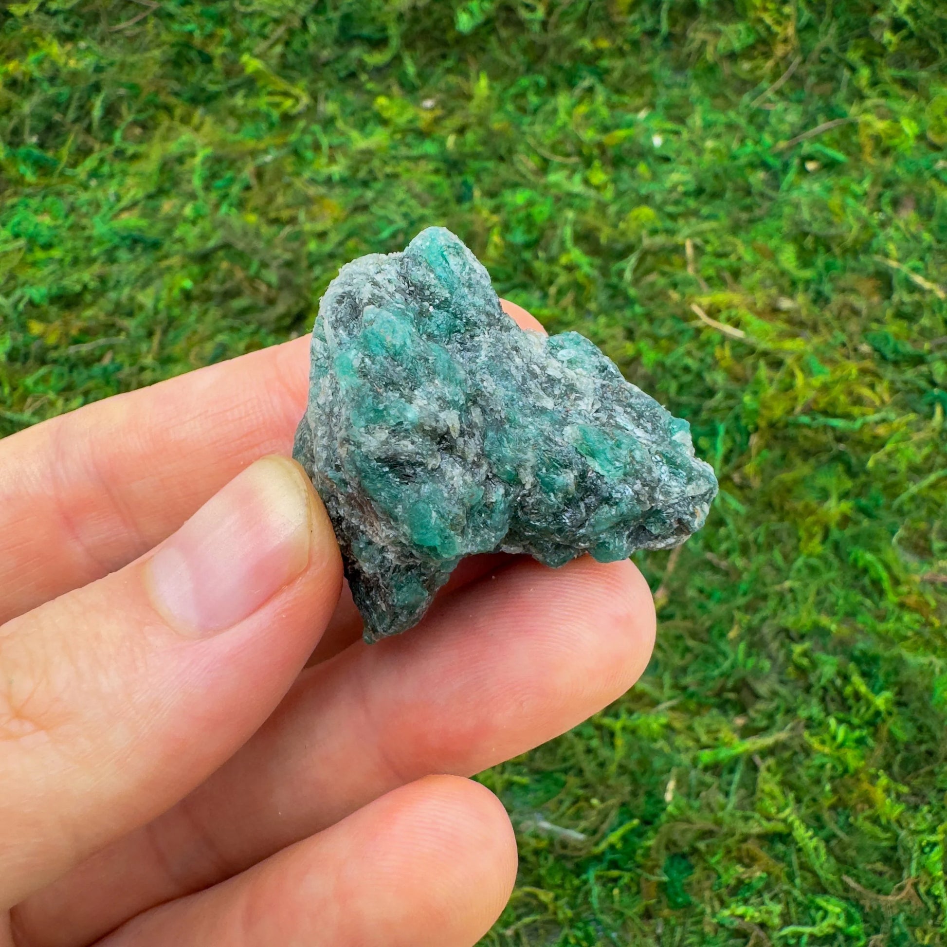 Back view of Grade AA Emerald raw showing natural surface