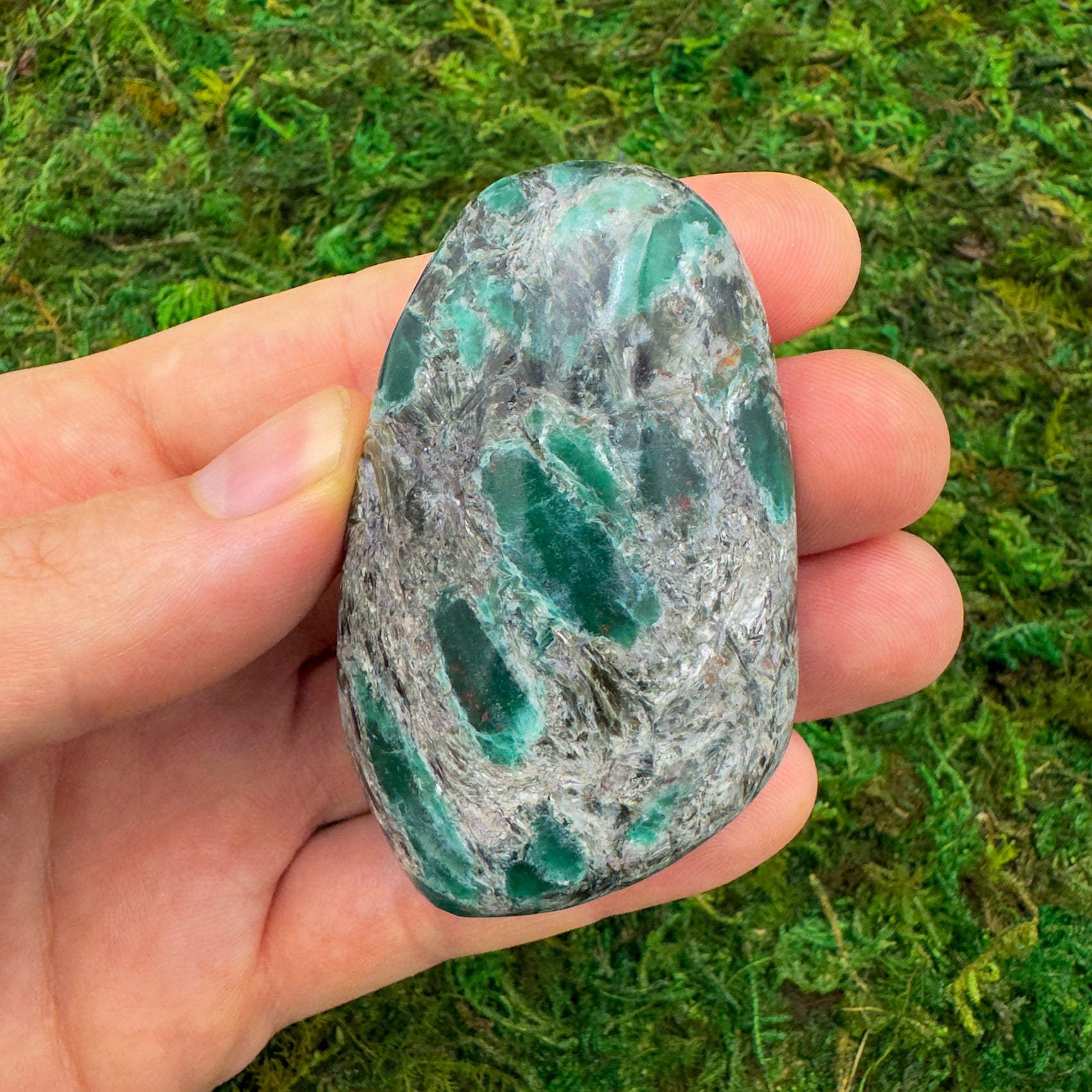 Close-up of Emerald palm stone from Zimbabwe, soothing wellness stone for Healing