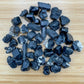 Sideways view of Black Tourmaline raw stone, Namibia-sourced, showing honest grain.