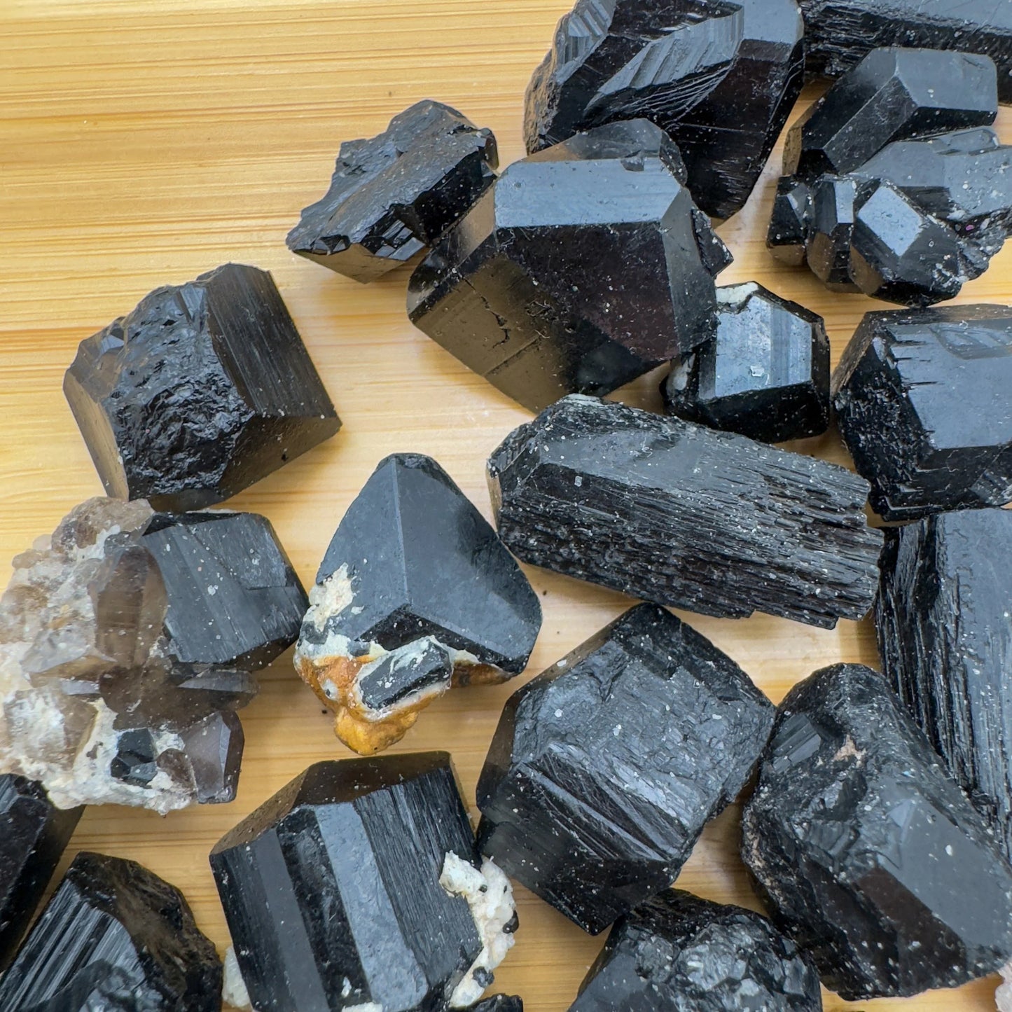 Overhead view of Black Tourmaline raw stone, showing tight grain, turned to for Protection and Grounding.