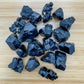 Profile shot of Grade AA Black Tourmaline raw stone, hand-selected from Erongo, Namibia, showing characteristic color.