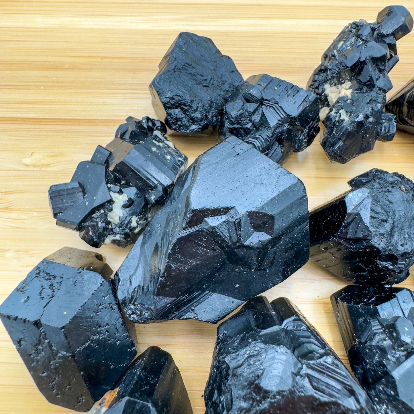 Looking down on Black Tourmaline raw stone, showing open form, linked to Protection and Grounding.