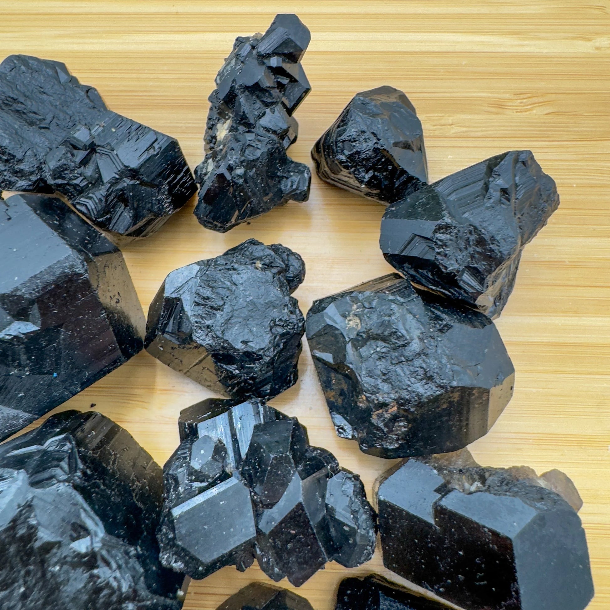 Reverse side of Black Tourmaline raw stone, showing natural sheen.