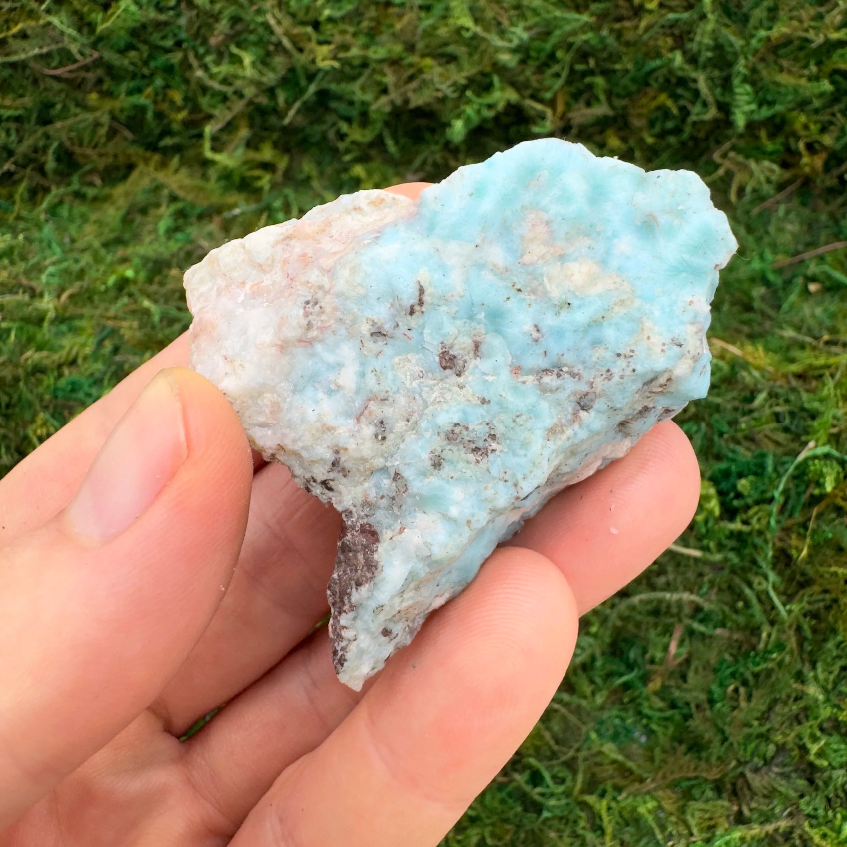 Reverse side of Larimar raw stone, showing characteristic finish.