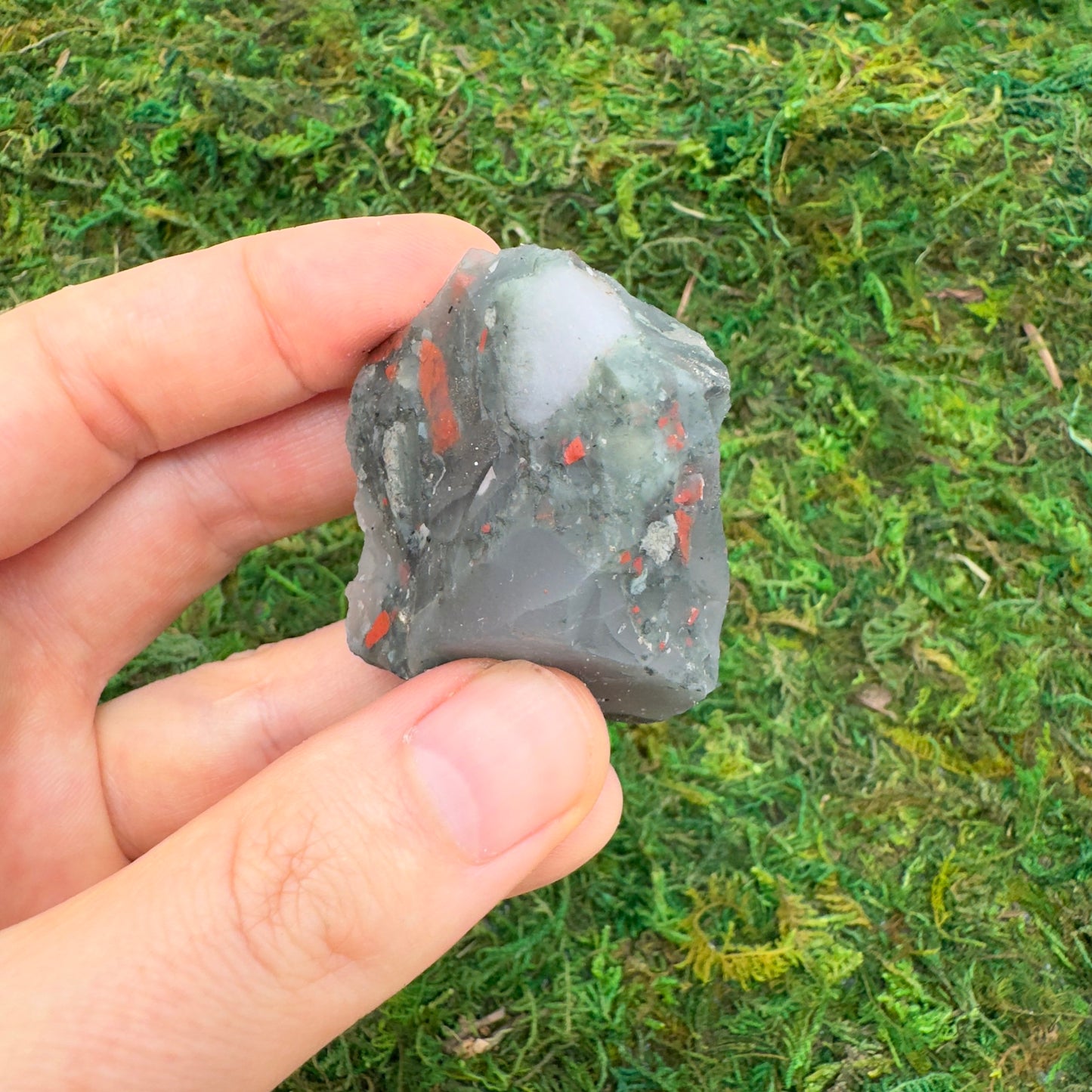 Back view of Grade AA Bloodstone raw showing natural surface