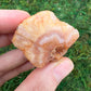 Back view of Grade A Carnelian raw showing natural surface