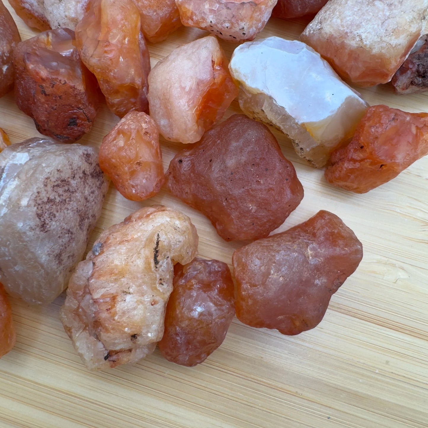 Side profile of Grade A Carnelian raw with natural form and inclusions