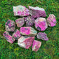 Natural light view of a Cobalt Calcite raw stone, sourced from Democratic Republic of the Congo.