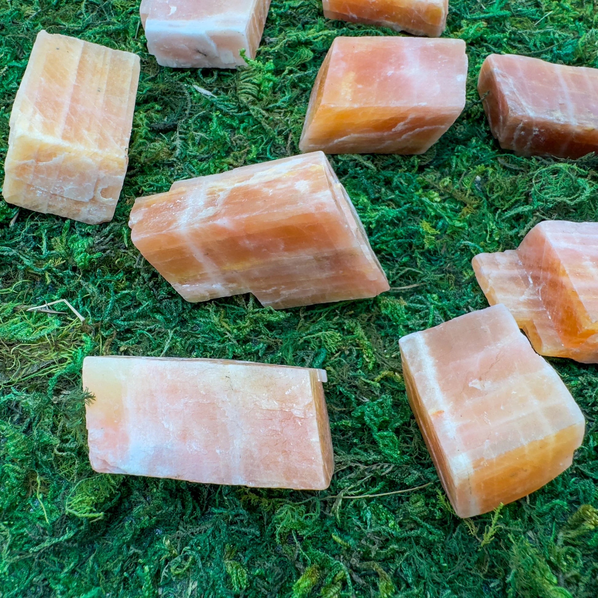 Back view of Grade AA Orange Calcite raw showing natural surface