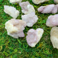 Grade aa quartz raw held in hand for size reference