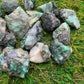 Back view of Grade AA Emerald raw showing natural surface