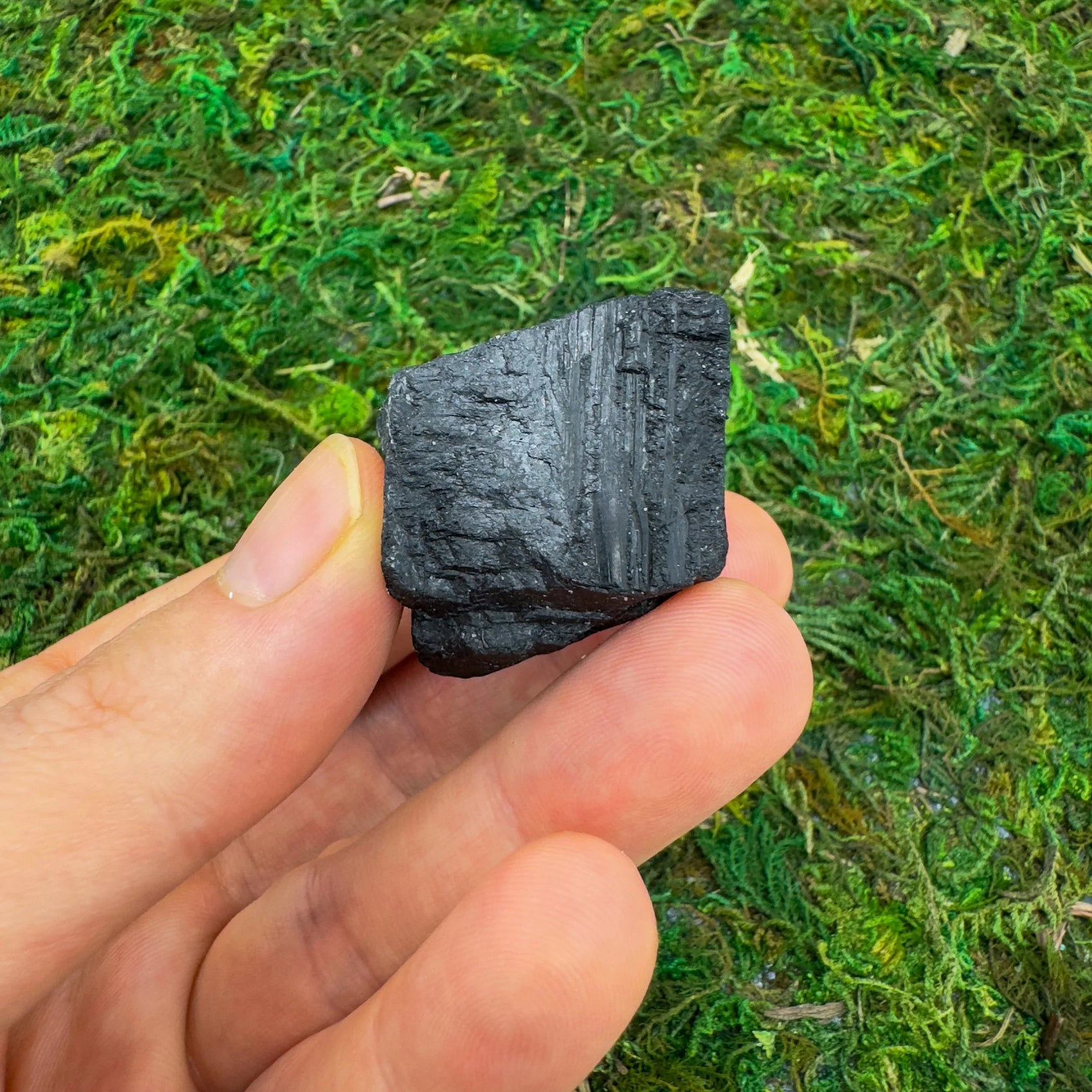 Close-up of Black Tourmaline raw crystal from Brazil, soothing wellness stone for Stress Relief