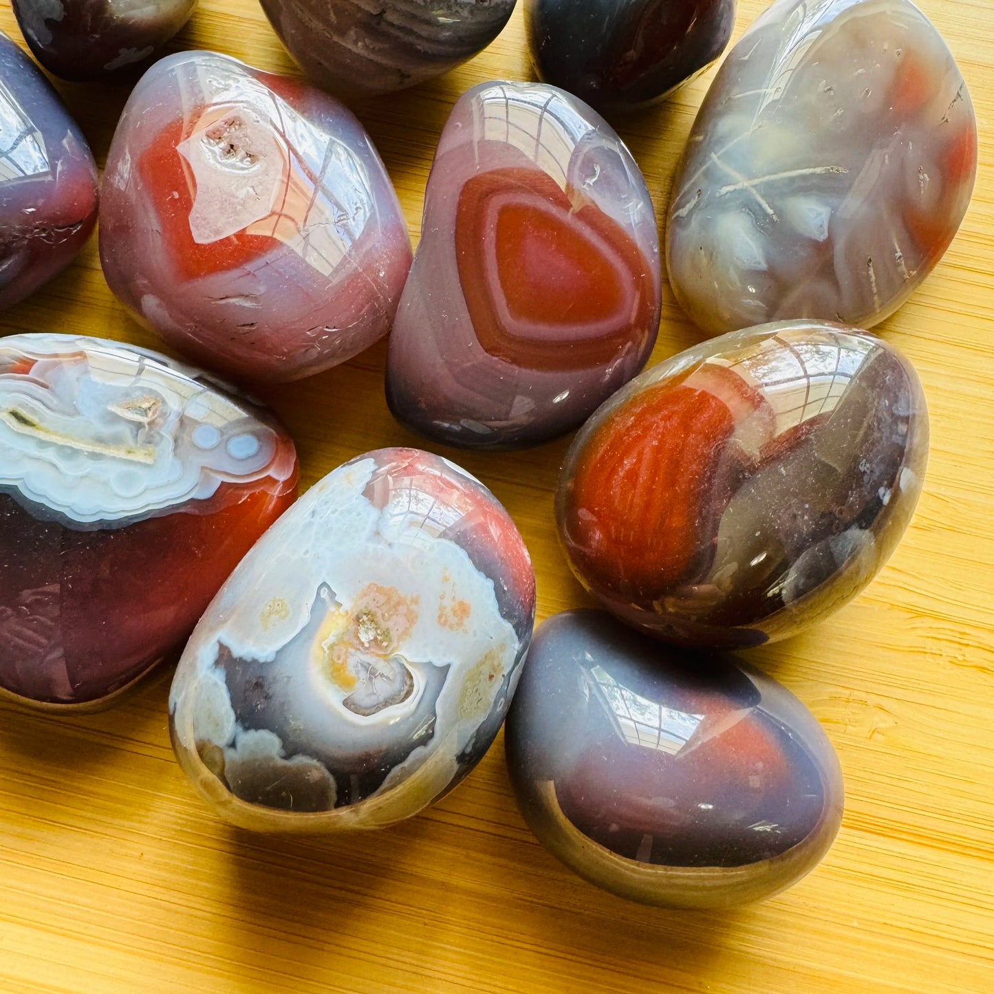 Bird's-eye view of Red Agate tumbled stone, showing characteristic color.