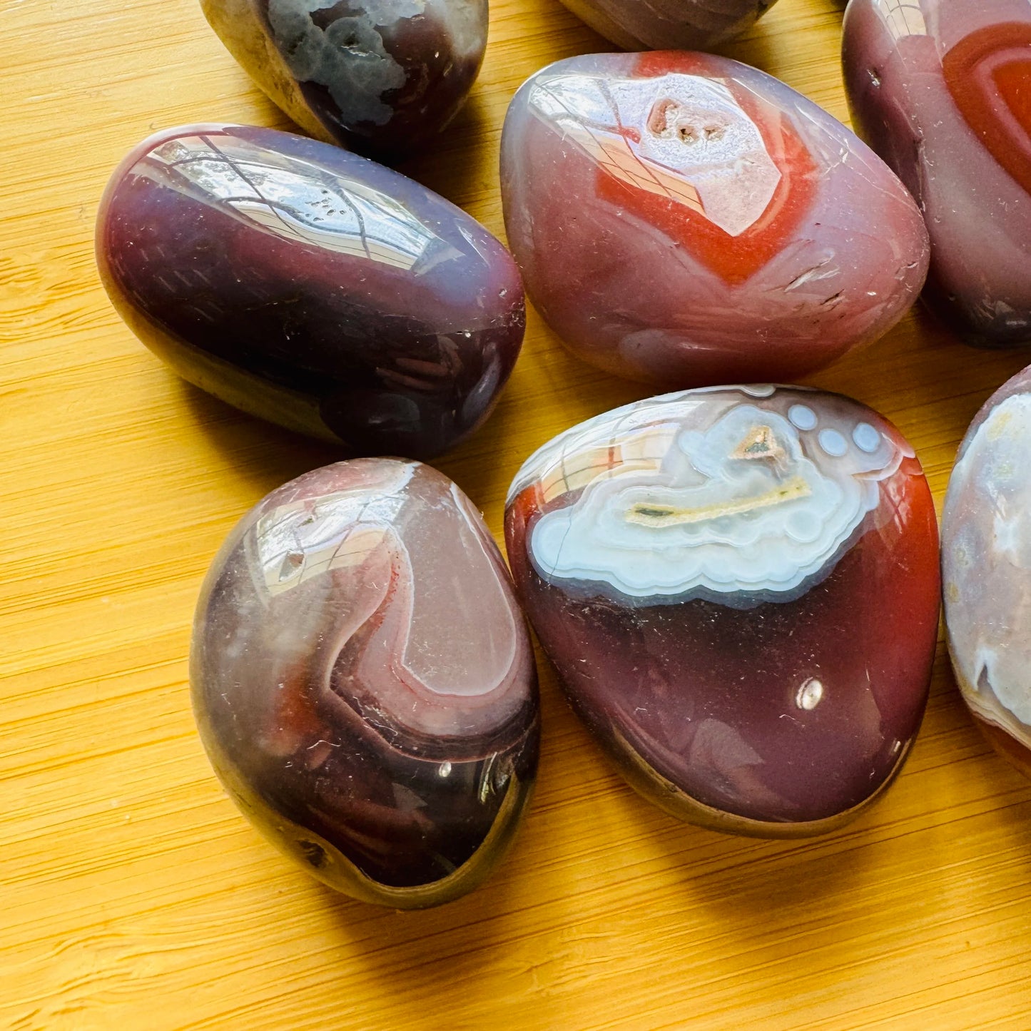 Underside detail of Red Agate tumbled stone, traditionally used for Grounding.
