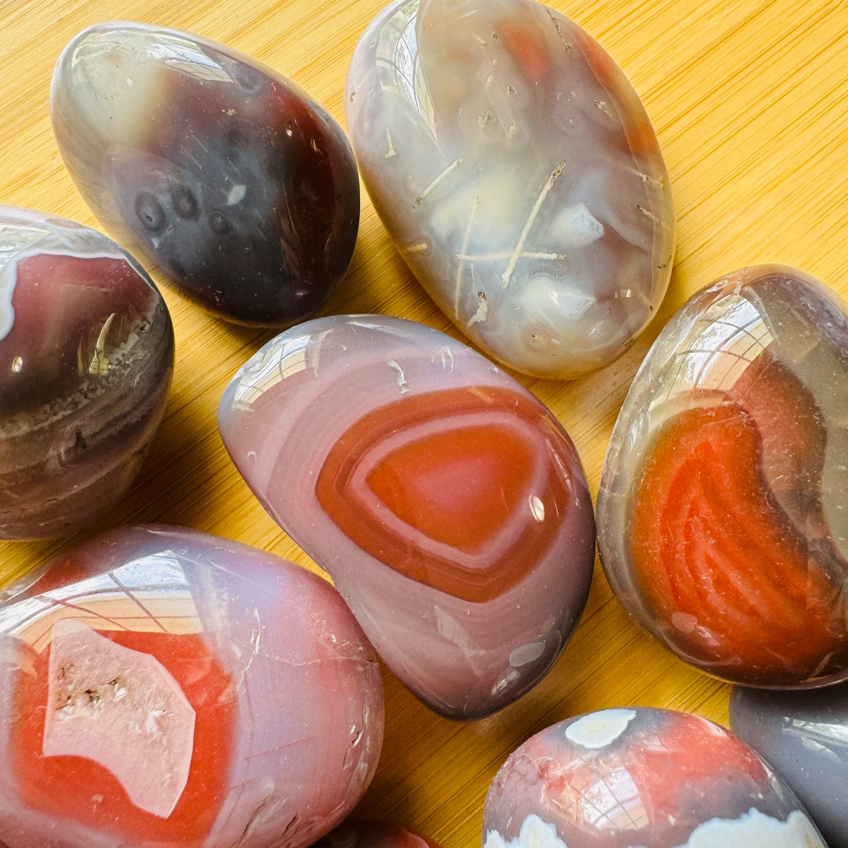 Near view of Red Agate tumbled stone, sourced from Zimbabwe.
