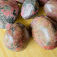 Looking down on Rhodonite freeform, showing matte finish.