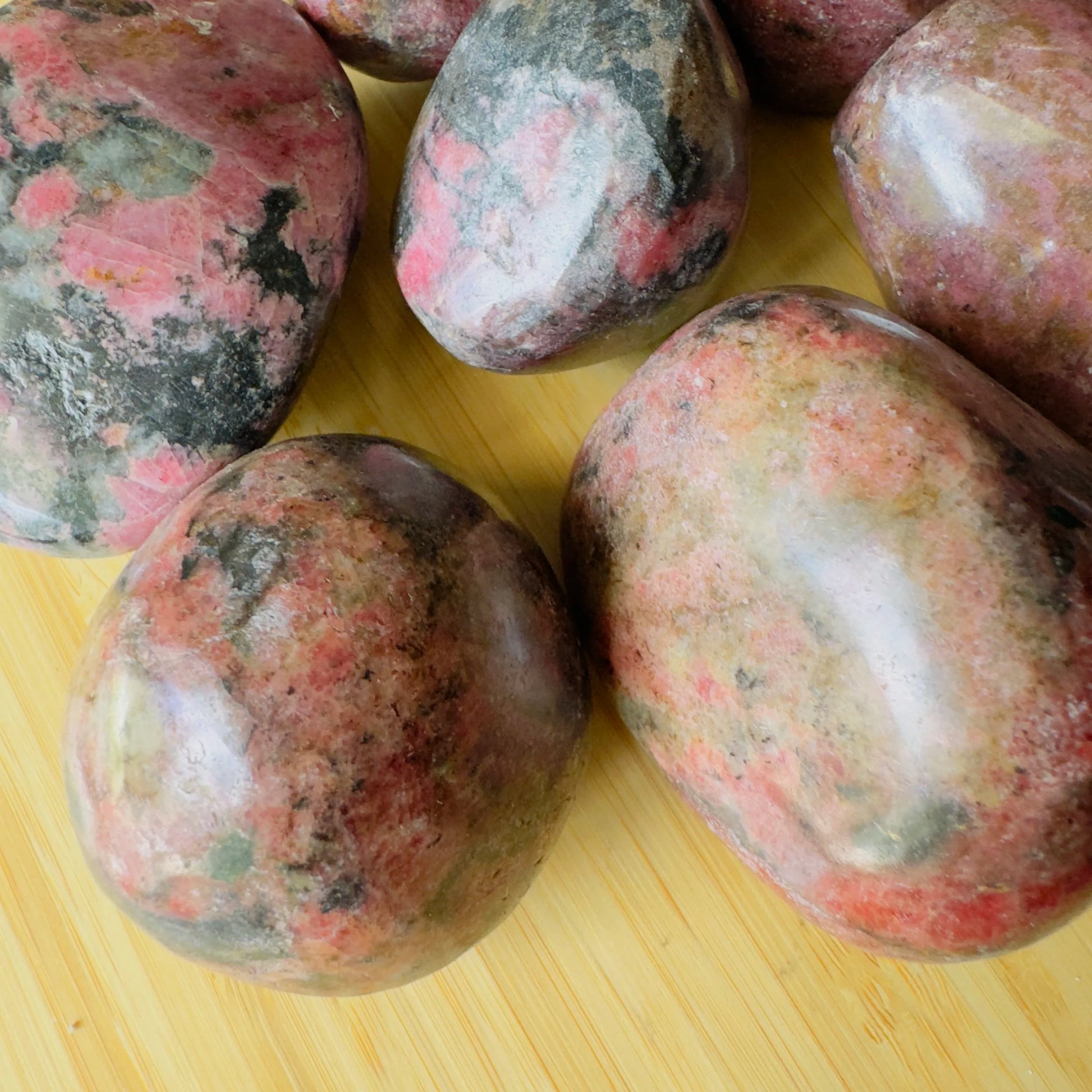 Looking down on Rhodonite freeform, showing matte finish.
