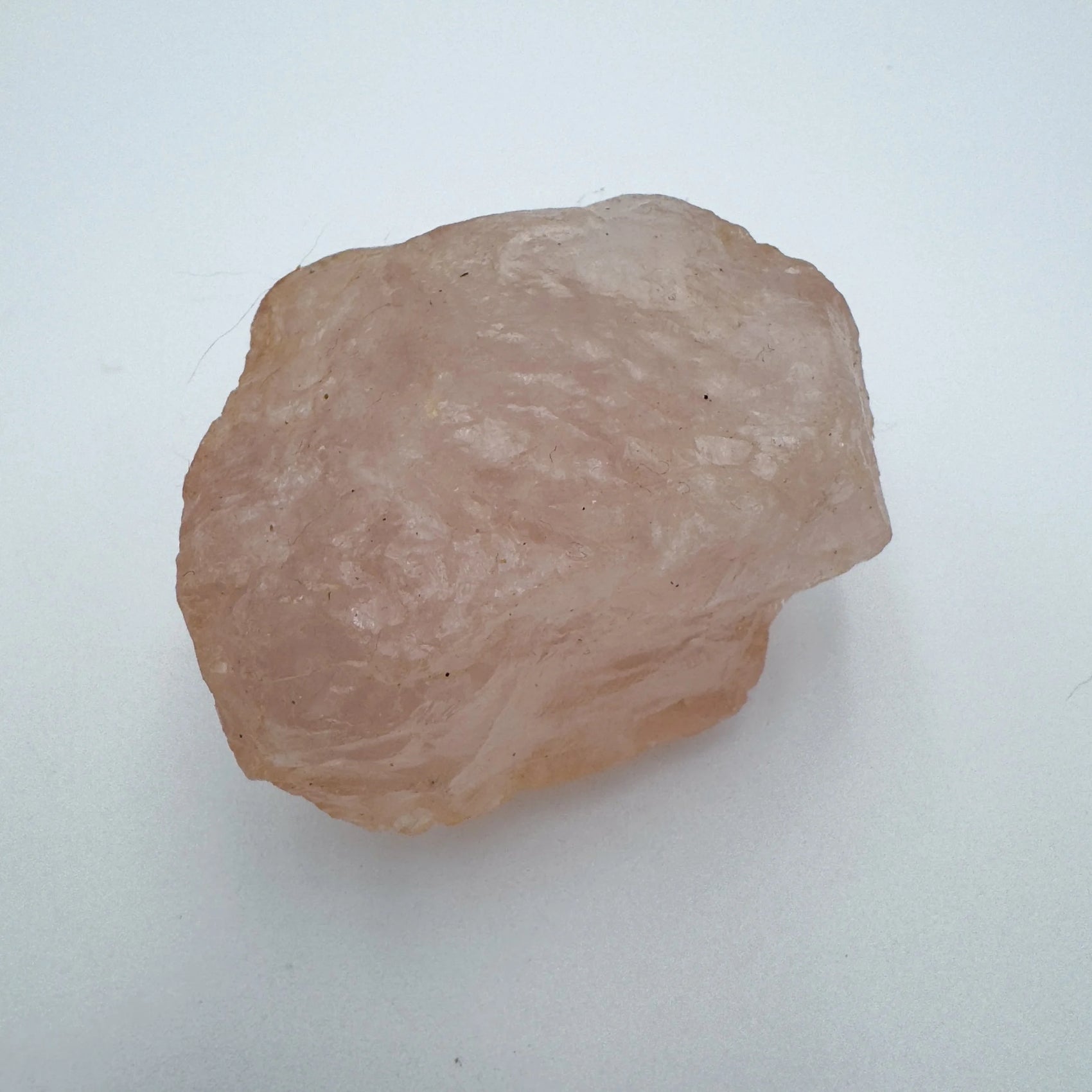 Top view of Grade AAA Rose Quartz specimen, kept near for Love and Self Love, Madagascar-sourced.
