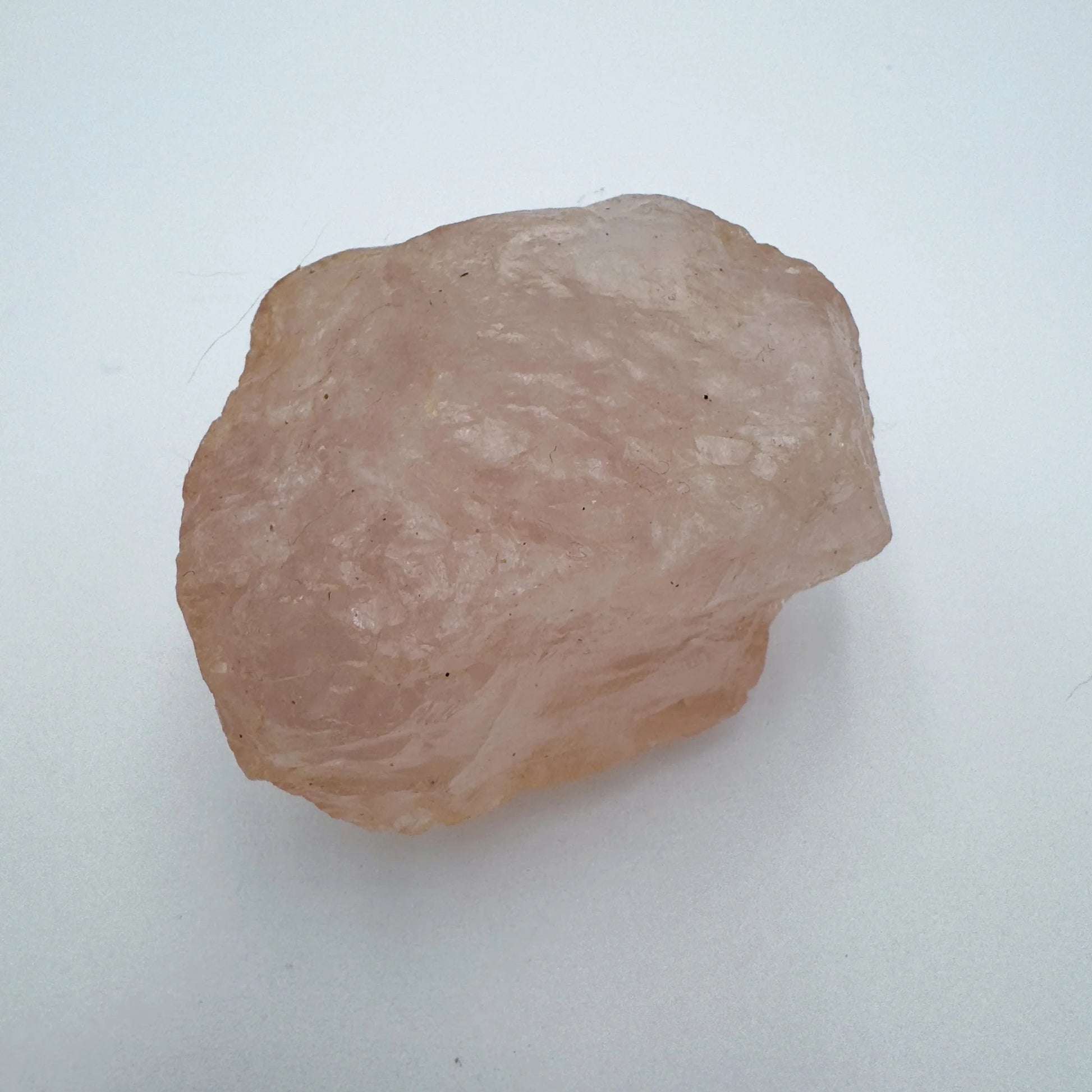 Top view of Grade AAA Rose Quartz specimen, kept near for Love and Self Love, Madagascar-sourced.