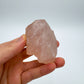 Back view of Grade AAA Rose Quartz specimen showing natural surface