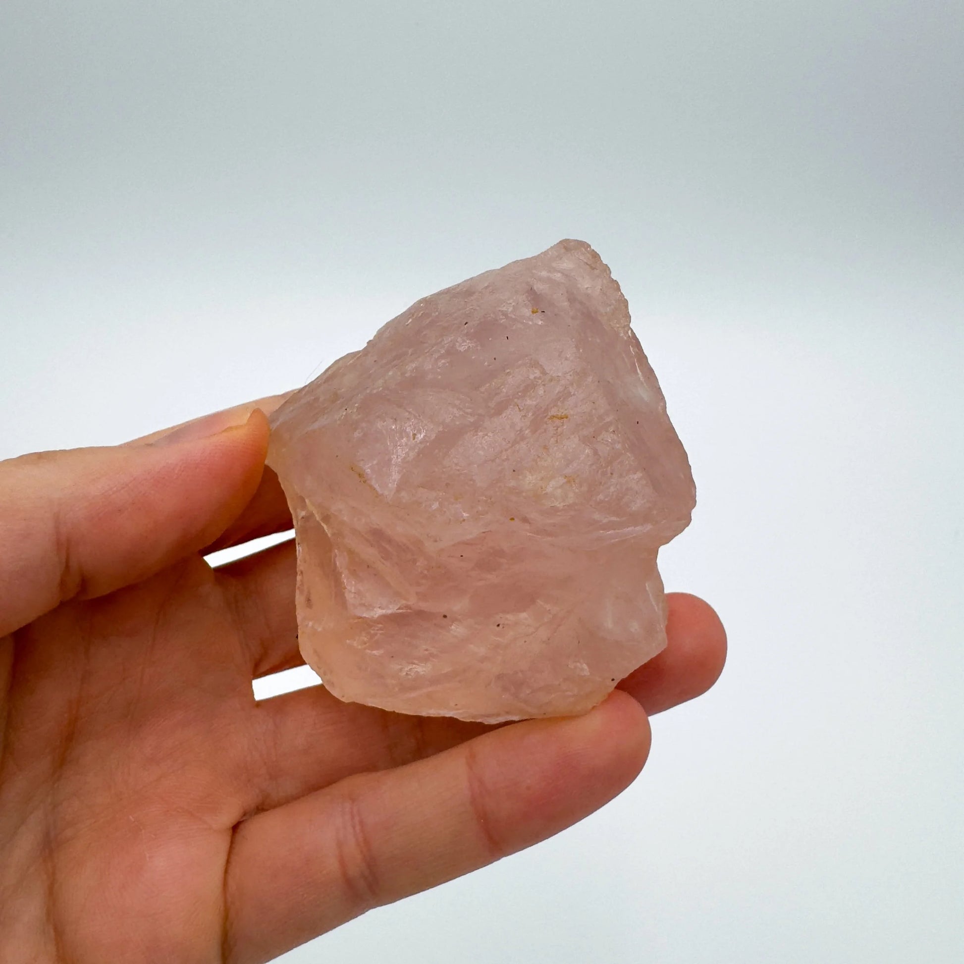 Detail shot of Grade AAA Rose Quartz specimen under natural light