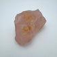 Side perspective of Rose Quartz specimen, sourced from Alaotra-Mangoro, Madagascar, showing earthy tone.