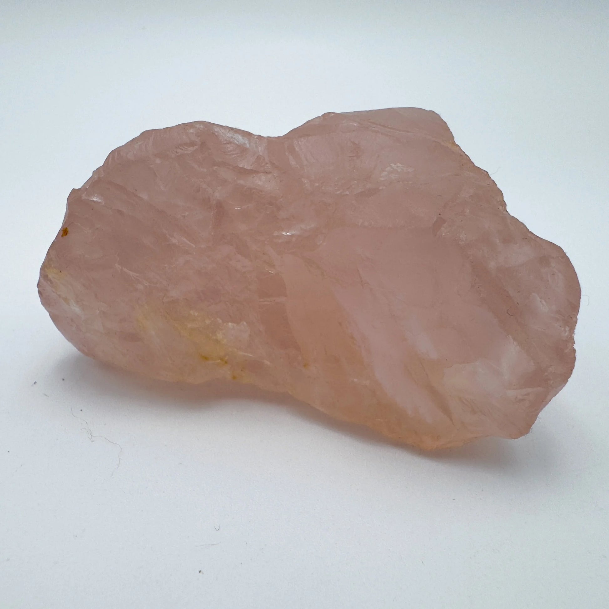 Hand-held view of a single Rose Quartz specimen sourced from Alaotra-Mangoro, Madagascar.