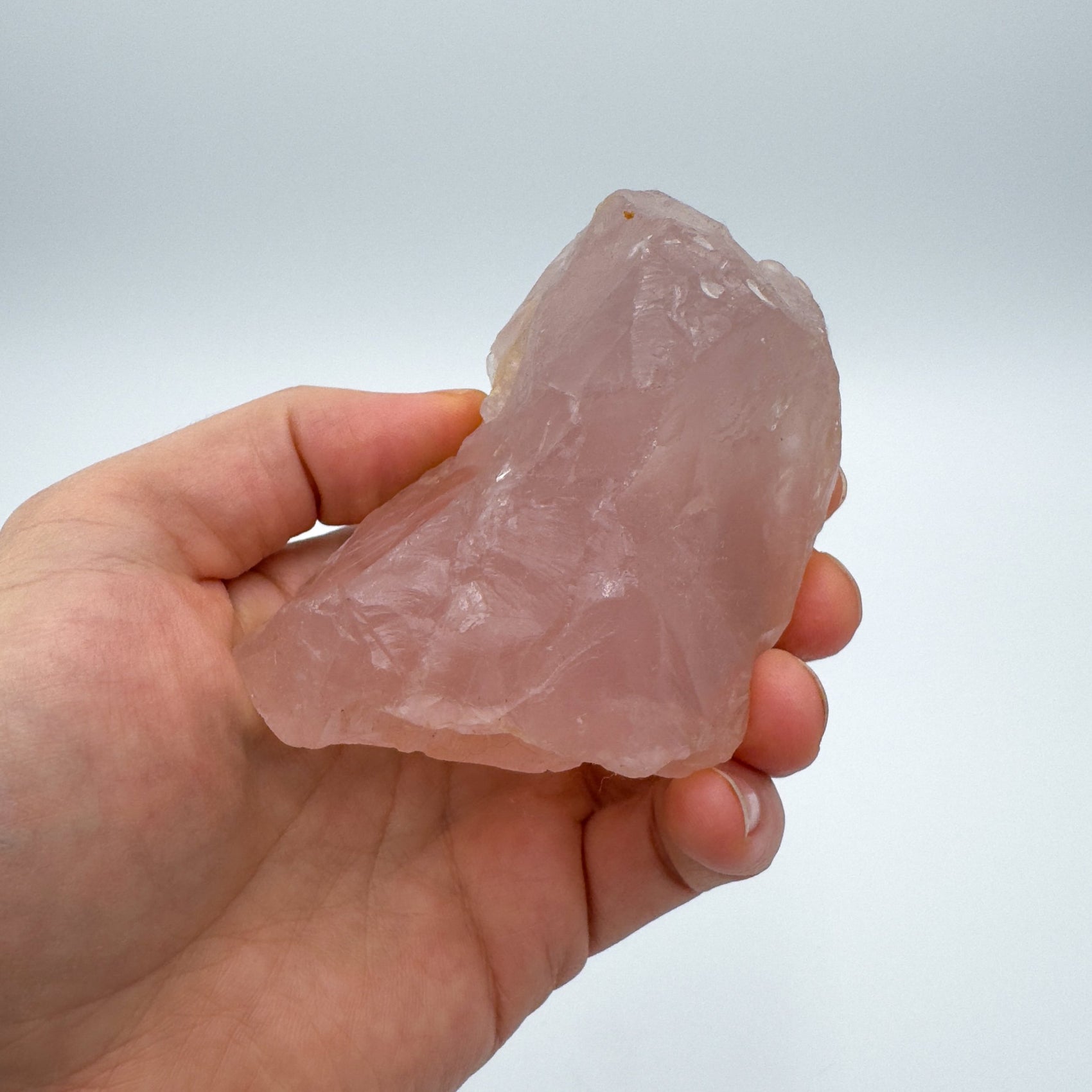 Back view of Grade AAA Rose Quartz specimen showing natural surface