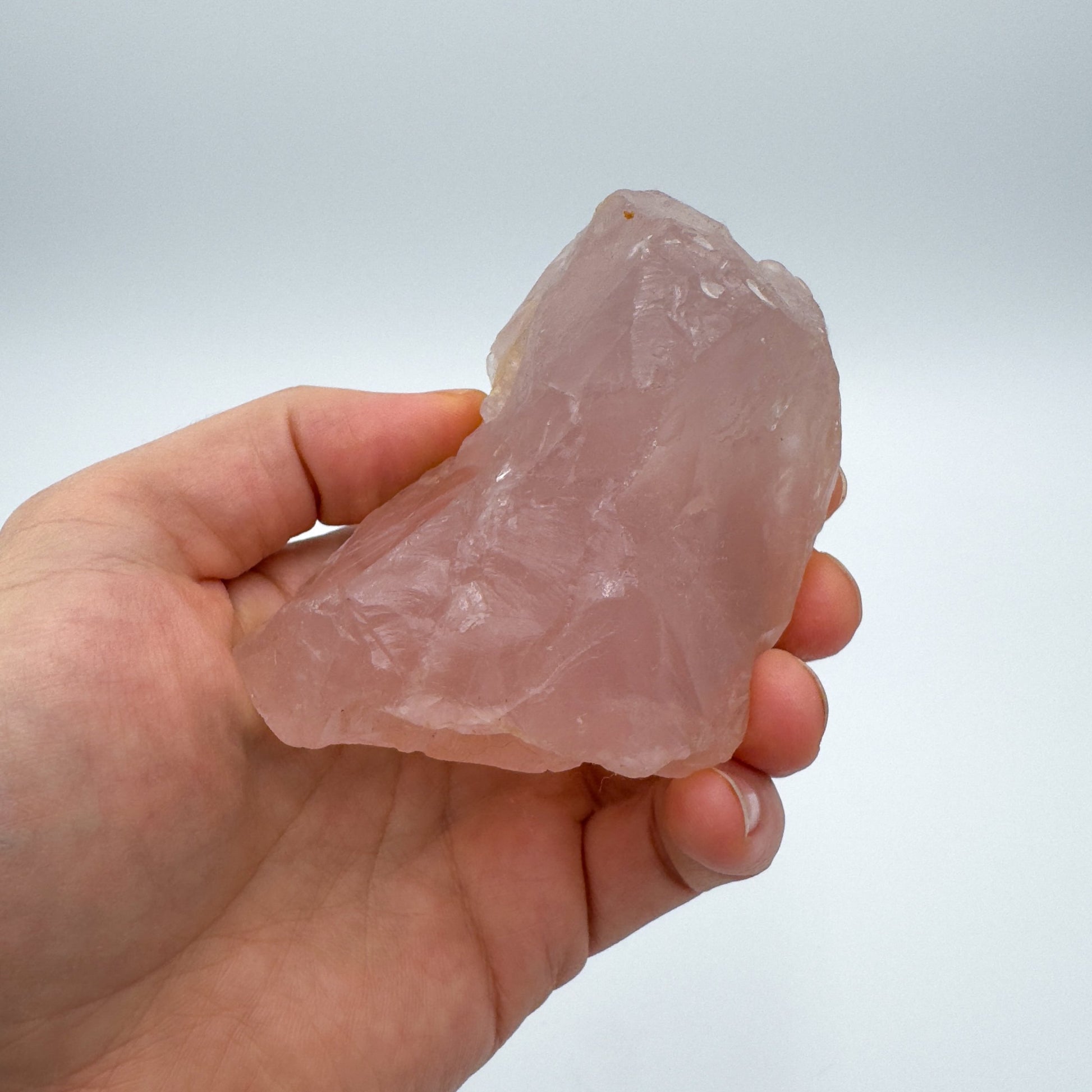 Back view of Grade AAA Rose Quartz specimen showing natural surface