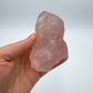 Detail shot of Grade AAA Rose Quartz specimen under natural light