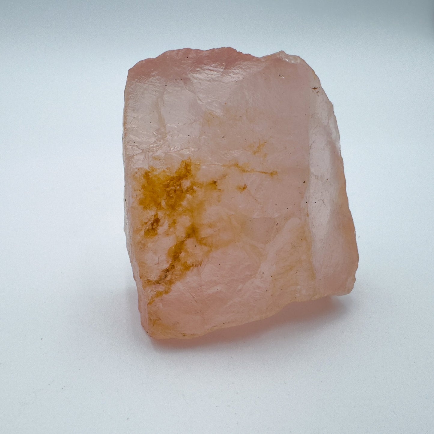 Profile shot of pink Rose Quartz specimen, often paired with practices around Love.