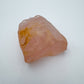 Daylight detail of Rose Quartz specimen, from Alaotra-Mangoro, Madagascar, shown for shape and scale.