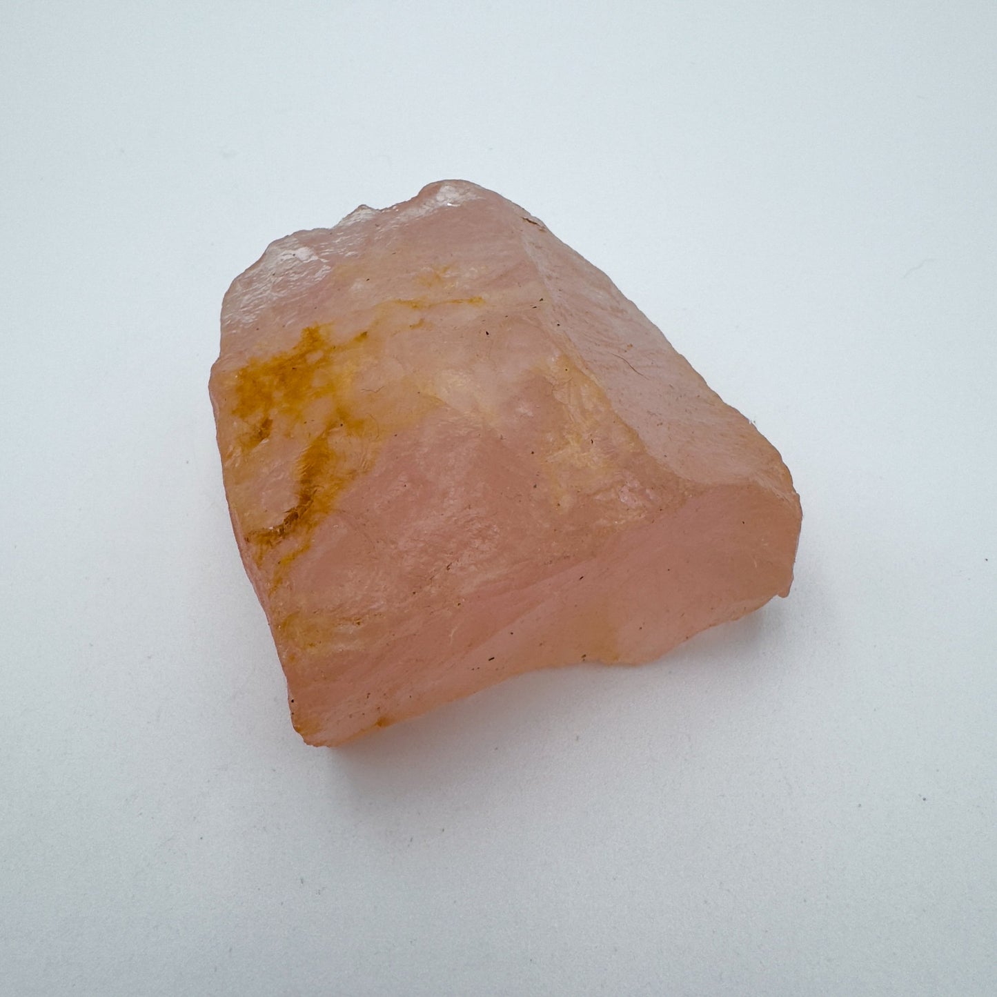 Daylight detail of Rose Quartz specimen, from Alaotra-Mangoro, Madagascar, shown for shape and scale.