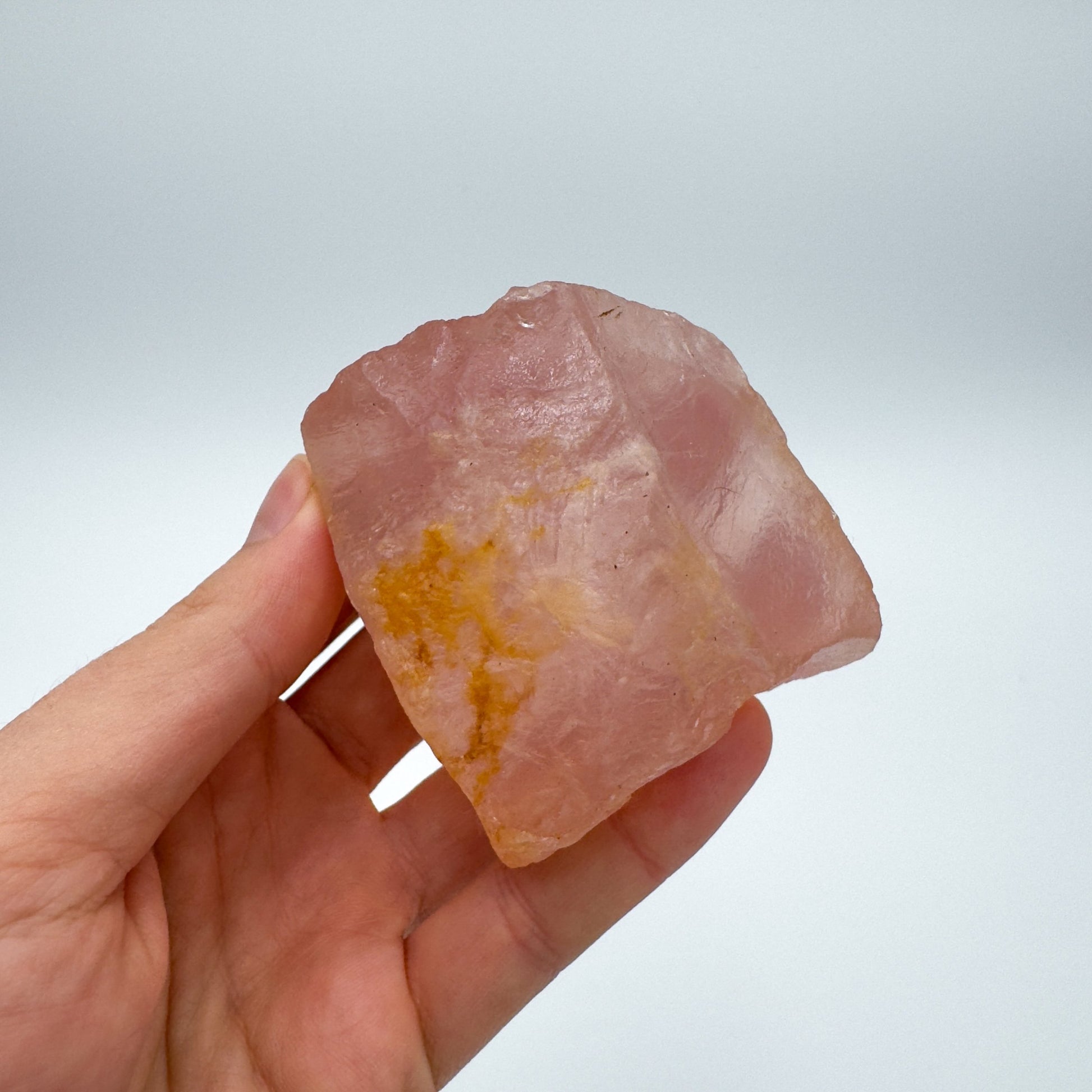 Back view of Grade AA Rose Quartz specimen showing natural surface