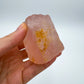 Detail shot of Grade AA Rose Quartz specimen under natural light