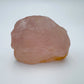 Side profile of Rose Quartz specimen, sourced from Alaotra-Mangoro, Madagascar, showing natural variation.